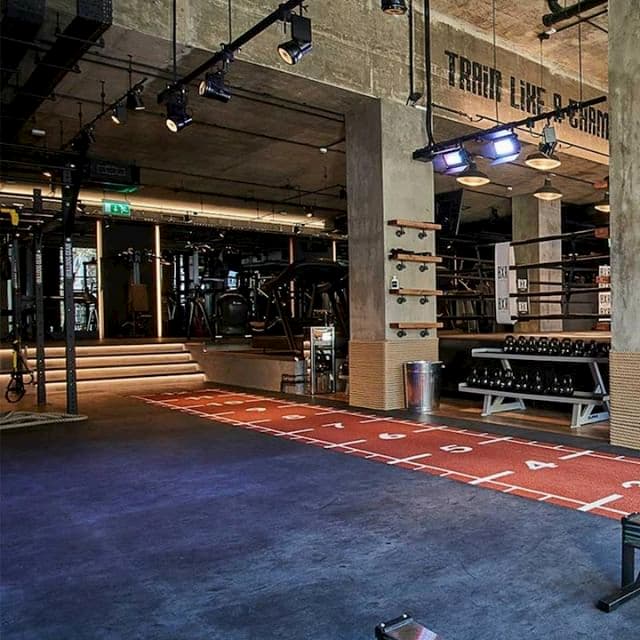 A crossfit area and a boxing ring