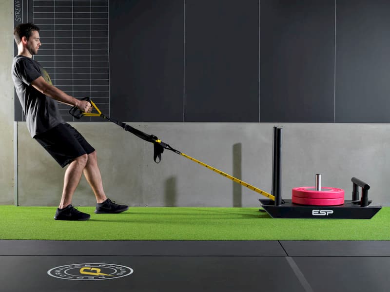 A person dragging weights