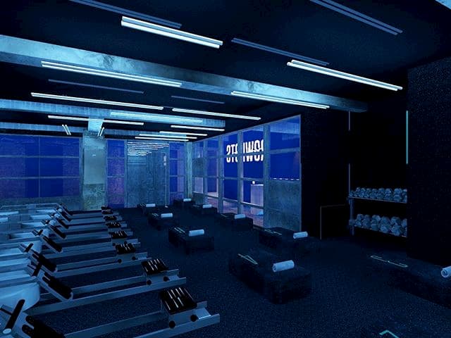  A dark room with rowing machines