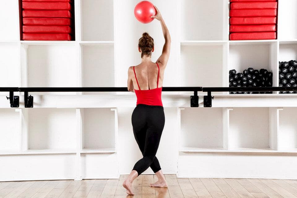 Woman with red exercise ball
