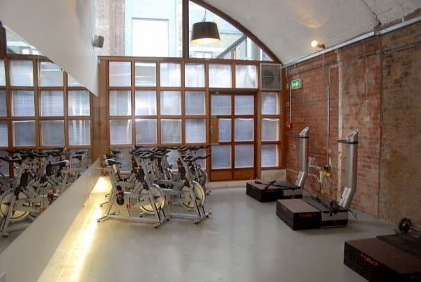 Spinning bikes in a brick room