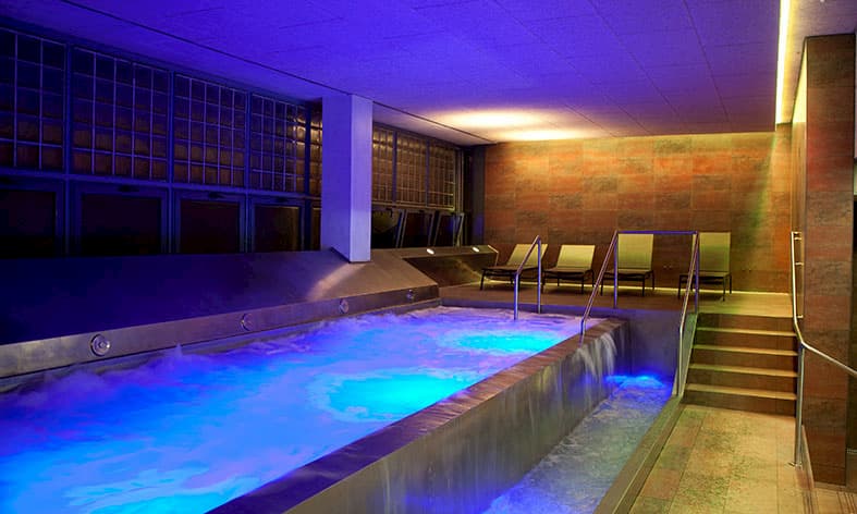 Room with rainbow colours and yoga mats