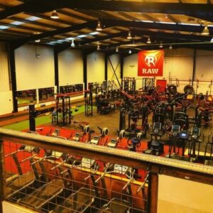 Fitness hall evening time raw logo